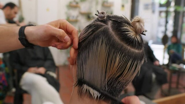 Hairdresser cutting hair in slow motion