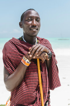 Masai portrait posing stand up at beach.