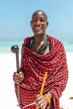Ethnic dressed african man smiling portrait.