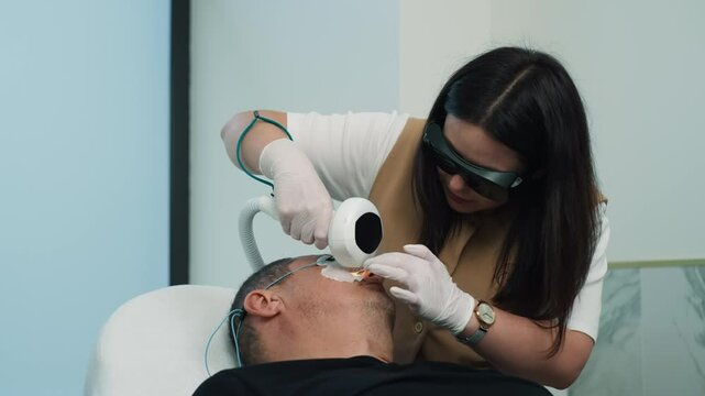 Cosmetologist doing skin cleansing procedure senior man. cosmetology procedures in cosmetology beauty and health. High quality 4k footage