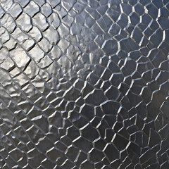 Captivating textured metal surface with unique geometric patterns and reflective qualities