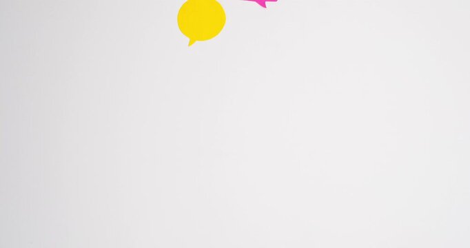 Pink and yellow speech bubbles dialogue. Communication and social connections concept. 4K stop motion animation