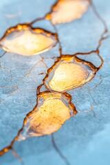 Kintsugi-Inspired Hair Styling Presentation Golden Ceramic Overlay on Marble - Innovative Beauty Techniques and Luxury Salon Educational Display