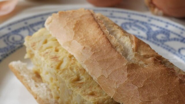 Fresh Spanish bocadillo tortilla sandwich on a plate, showcasing a delicious snack