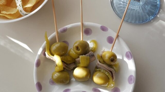 Delicious tapas of Gildas and Boquerones served with vermouth