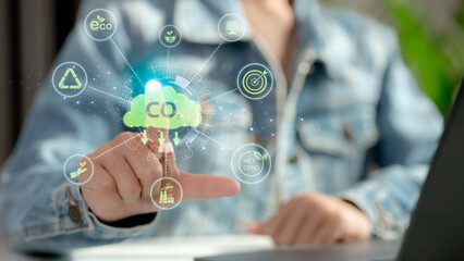 Innovation green business concept. A man report results to reduce CO2 emissions carbon footprint climate change and Net zero to limit global warming. Sustainable development