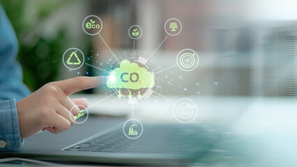 Fototapeta premium Innovation green business concept. A man report results to reduce CO2 emissions carbon footprint climate change and Net zero to limit global warming. Sustainable development