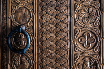 Religious wood relief on the door of the Svetitskhoveli Orthodox Christian cathedral and UNESCO World Heritage site in Mtskheta, Georgia