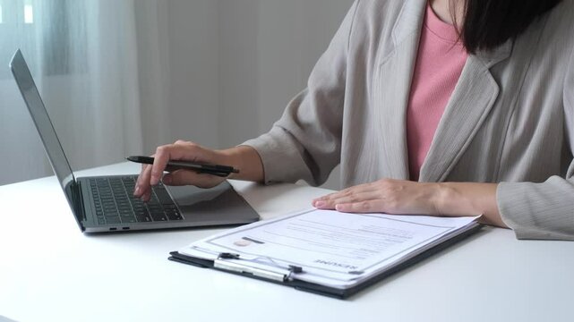 Executive CEO businesswoman checking job applicant documents resumes, interviews, and signing to approve the contract in the office room.
