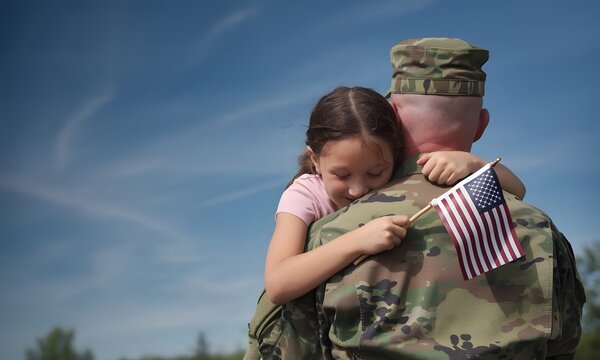 Proud soldier hugs daughter goodbye on deployment.