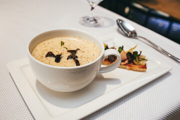 French onion soup with truffle and meat bruschetta close-up