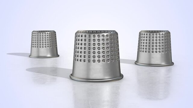 Metal Thimbles on a Light Reflective Floor. Vintage Thimbles 3D Animation. 4K