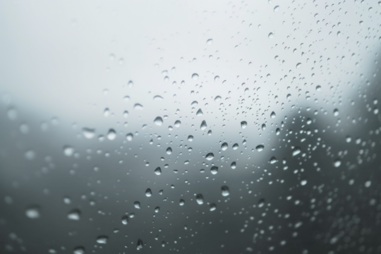 PNG Raindrops dripping on glass background water atmosphere.