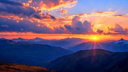 Naklejka premium Stunning sunset over majestic mountains and clouds