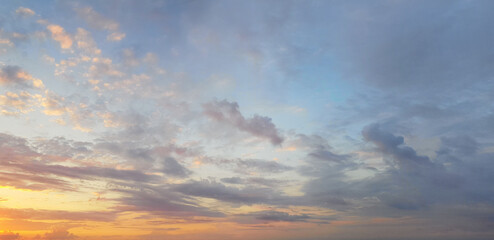 Dawn sky background. Colourful gold sky with clouds and sun light