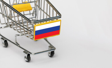 Shopping, VAT and retail in Russia concept. Shopping Cart with Russian flag on white background