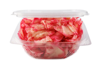 Korean spicy kimchi cabbage salad in plastic container isolated on white background.