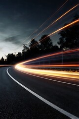 Obraz premium Nighttime Highway Curves with Light Trails Background design, vibrant orange and yellow light trails.