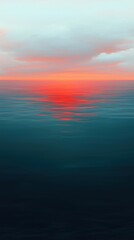 Obraz premium Golden-orange sunset illuminating tranquil ocean waters during a quiet evening