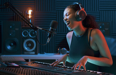Artist recording a song in the studio