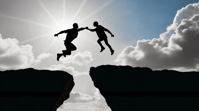 Two men are leaping over a large rock, one of them is about to catch the other. Concept of teamwork and support, as the two men are working together to overcome a challenge