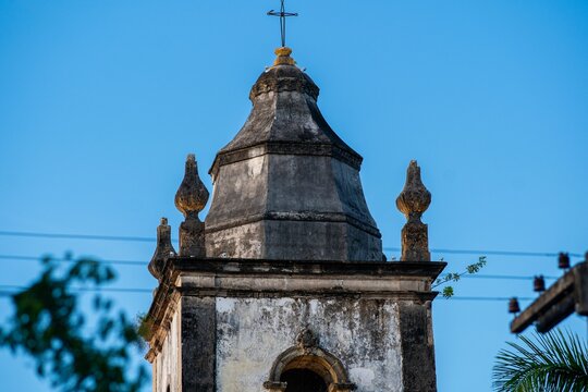 Historic church tower under blue sky