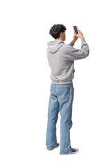 Teenager taking pictures with his smartphone