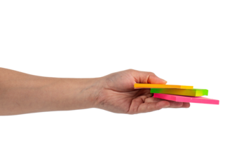 Paper stickers in hand. Hand holding a green sticker. Notes for the message on transparent background.