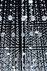 Crystal balls suspended from ropes.interior decoration for luxury concepts. Shiny sparkling background
