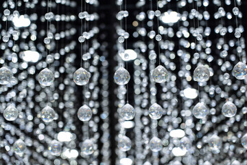 Crystal balls suspended from ropes.interior decoration for luxury concepts. Shiny sparkling background