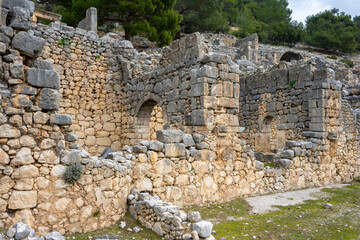 Remains of gymnasium in acnient Lycian city Arycanda. Ancient city on mountain near Aykiricay village.Well preserved semi-circular theater of Arycanda, ancient Lycian city in Antalya
