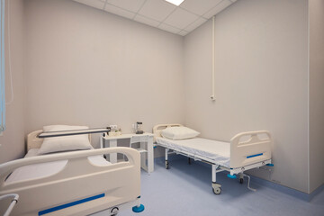 A Hospital Bed located within a Medical Facility designed for patient comfort and care
