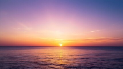 Fototapeta premium Vibrant Sunset Over Calm Ocean Water