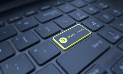 cryptocurrency concept on a highlighted keyboard key. Business and finance