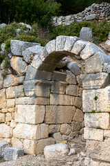 Remains of gymnasium in acnient Lycian city Arycanda. Ancient city on mountain near Aykiricay village.Well preserved semi-circular theater of Arycanda, ancient Lycian city in Antalya, Turkey.

