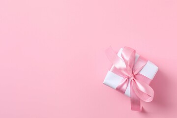 Beautiful gift box on pink background