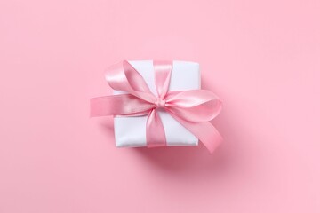 Beautiful gift box on pink background