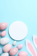 Happy Easter. Colorful eggs and Easter bunny ears on a pastel blue background, space for text or advertising