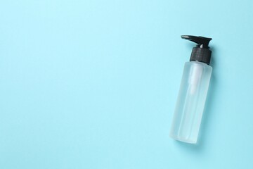 Natural cosmetic products. Cosmetic bottle on a blue background, top view