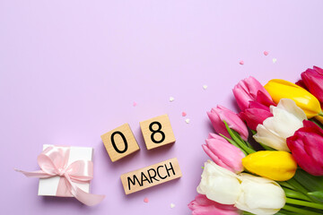 8 March greeting card design with tulip flowers and gift box, top view. Happy International Women's Day