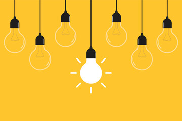 Hanging light bulbs on yellow background