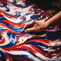 Naklejka premium A close-up of a hand painting a red, white, and blue design on a canvas, celebrating US Independence Day.