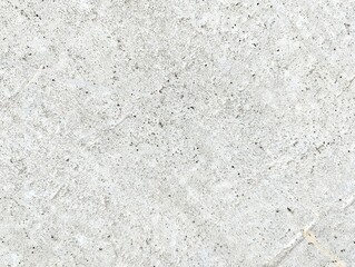 Abstract black and white concrete texture with speckled surface pattern. Weathered cement wall with porous finish. Industrial grunge background