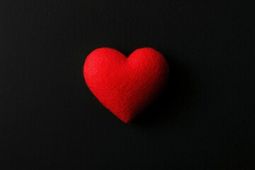 Red heart symbol on black background for health, love, or valentines day use