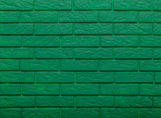 Green brick wall with a green color