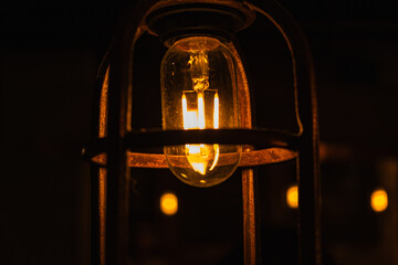 Warm ceiling light with a retro lamp in a cafe