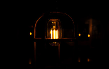 Warm ceiling light with a retro lamp in a cafe