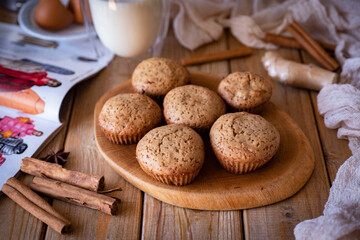 Cinnamon muffins for dessert on a wooden table. Delicious muffins for breakfast. Close-up
