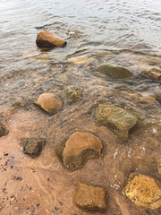 Stones in a lake with clear water. Natural background.