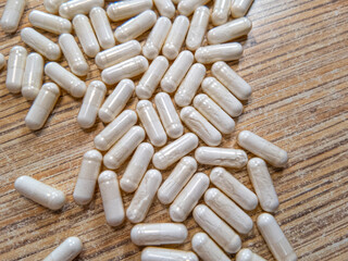 Different pills slowmotion. Colored pills of different shapes fall down. Falling drugs on a transparent background. Pharmaceutical business concept. Medicine capsules backdrop. Pharmacology concept.